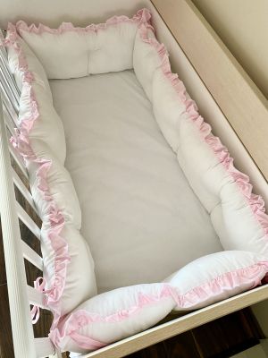 White crib bumpers with pink ruffles 